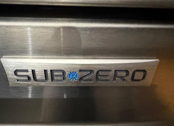 Sub-Zero stainless steel refrigerator logo – expert repair by NYC Sub-Zero & Viking Appliance Repair